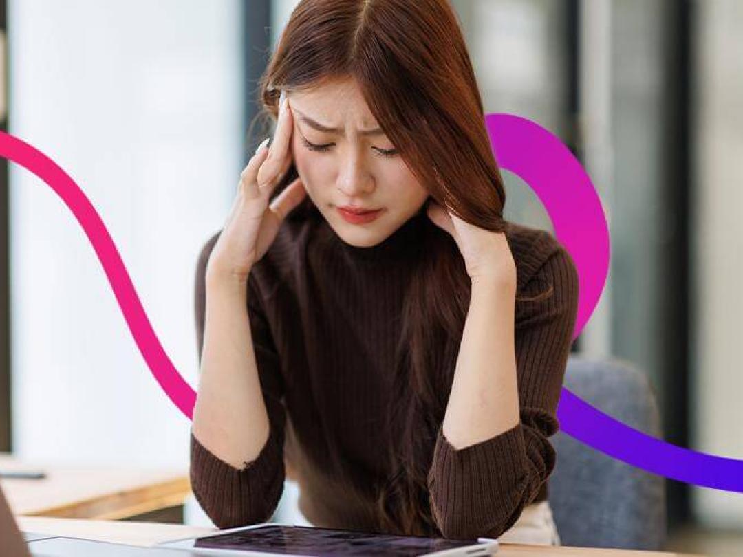 Woman with head in hands looking concerned