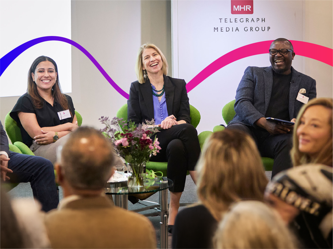 Duro Oye, Maggie De Pree and Anisa Morridadi laughing on a panel.