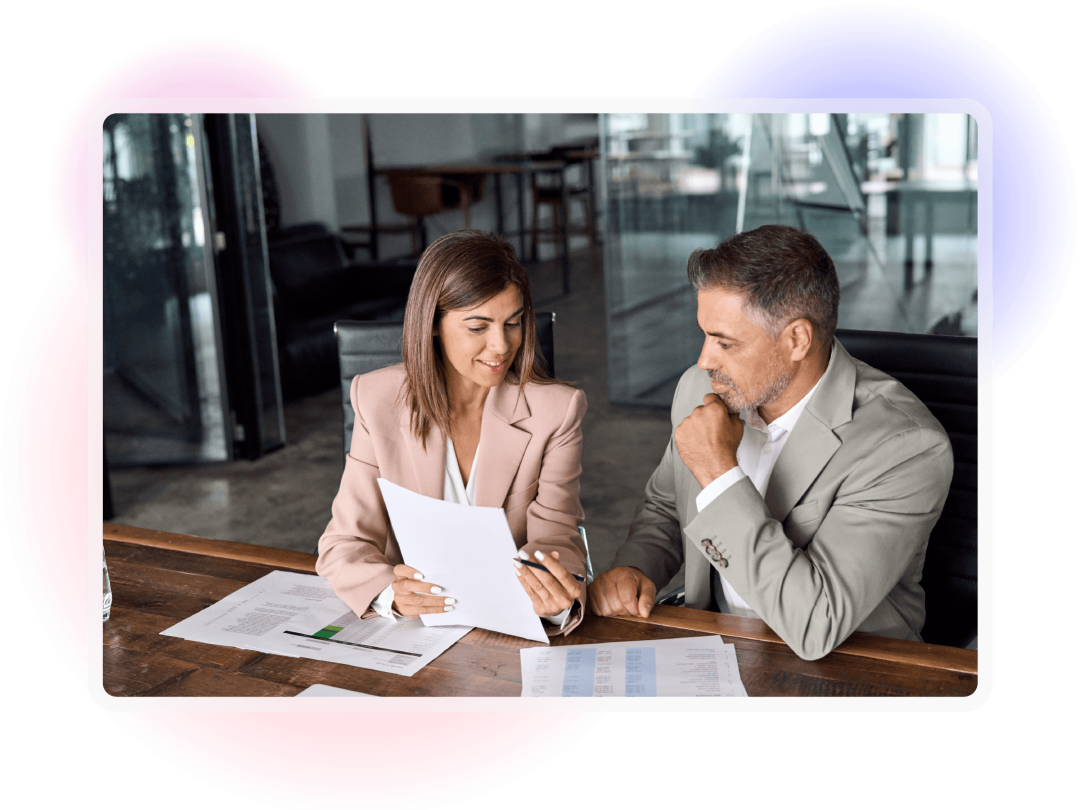 Professionals reviewing financial reports and performance insights.