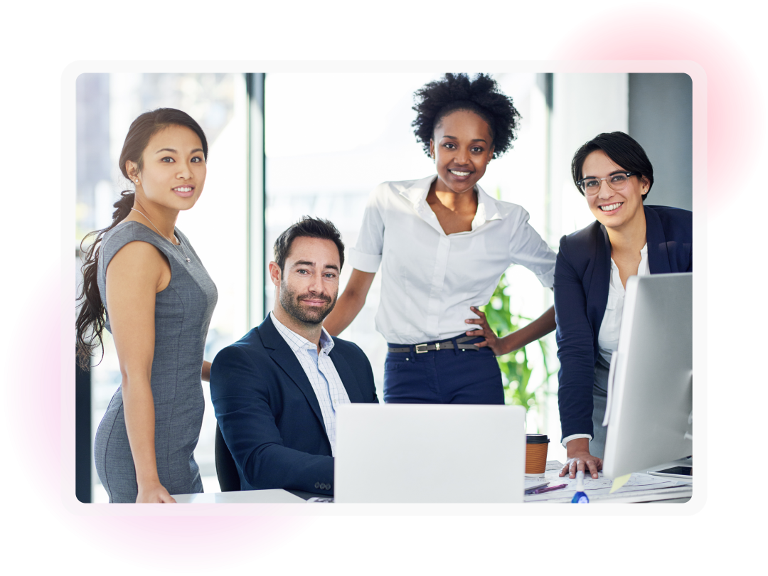 A team of colleagues working together around a computer