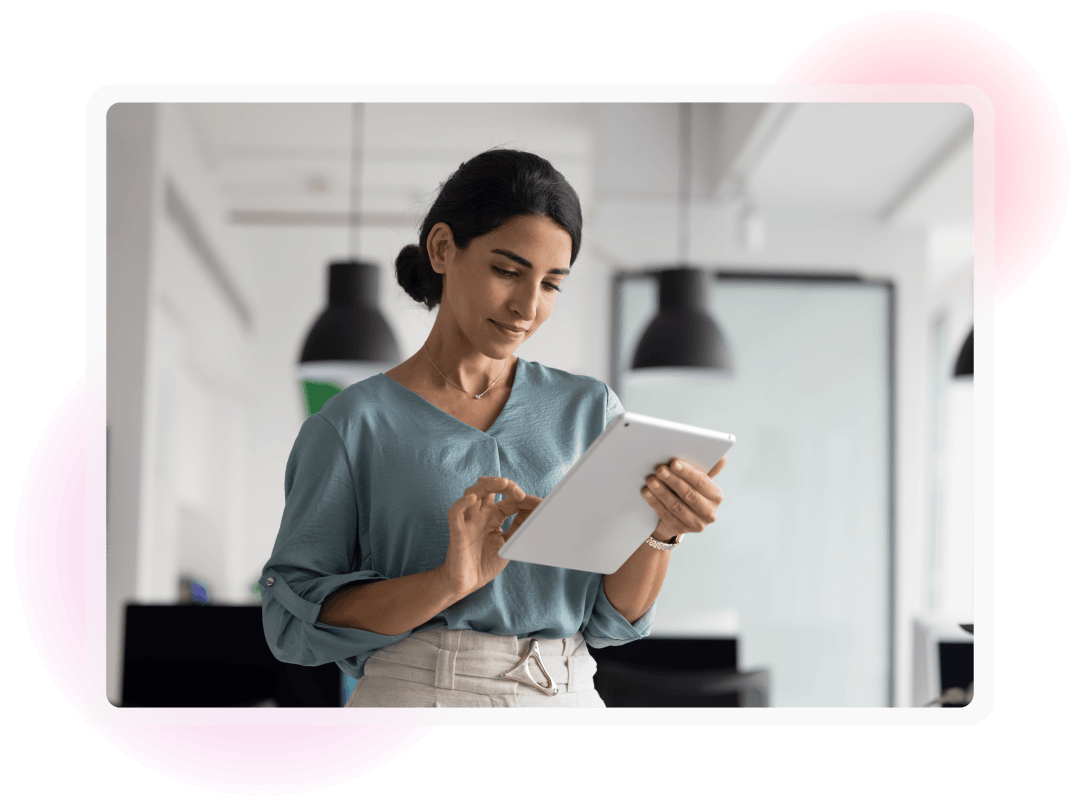 Woman stood working on an iPad