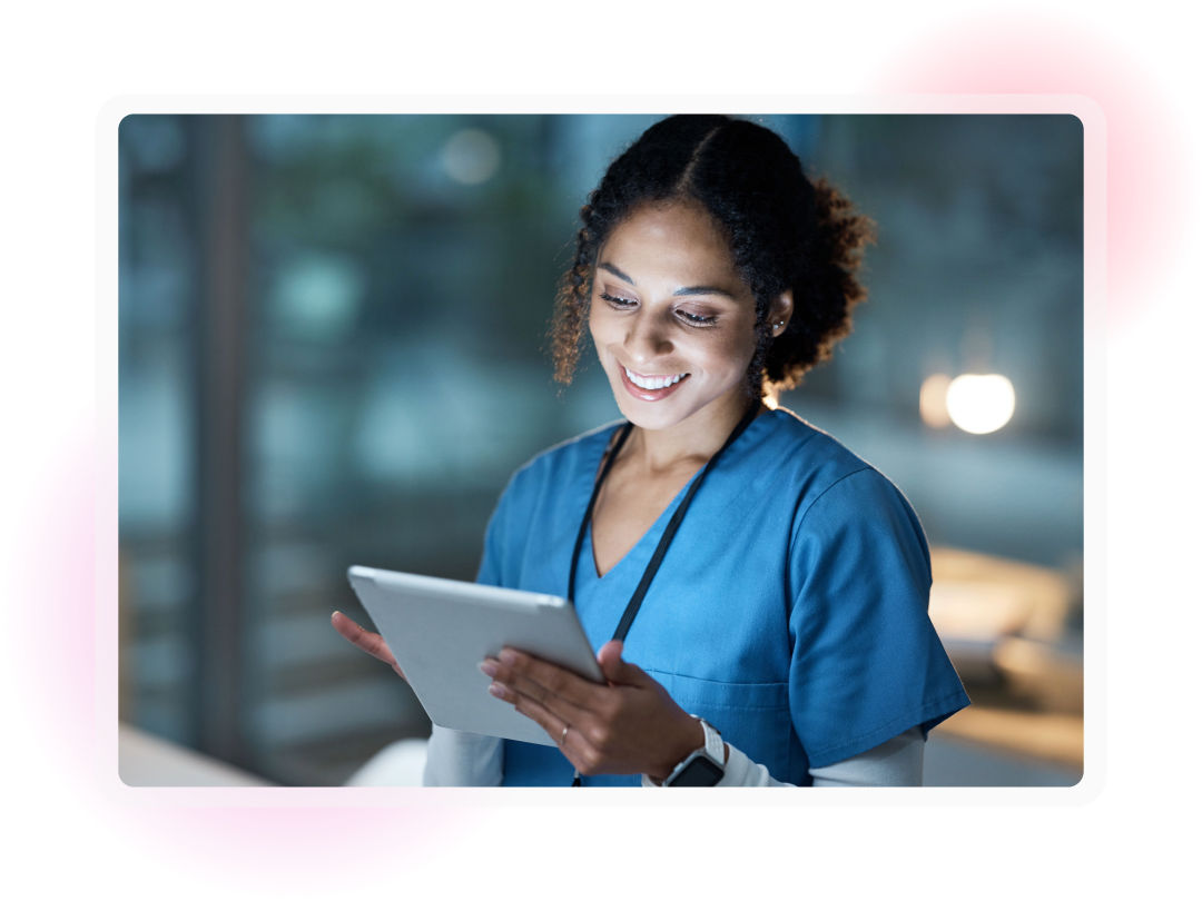 A female doctor looking at an ipad