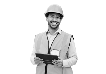 Construction employee smiling at tablet now he's connected to his workforce from anywhere.