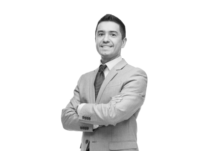 Man smiling after using ERP manufacturing to reduce complexity and easily make strategic decisions.