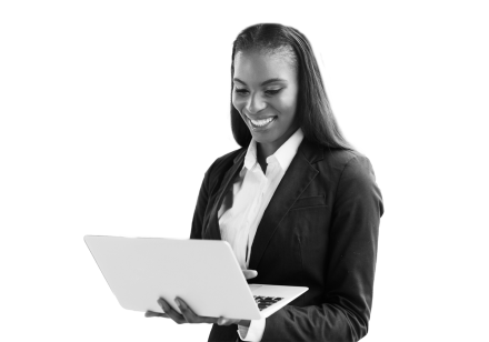 Woman smiling looking at her laptop after integrating all her siloed systems into one, making it easier to report