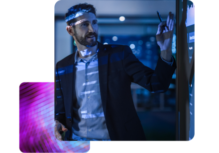 A man stood in a dark room presenting next to a screen, showing his team forecasting through partnership with CCH Tagetik.